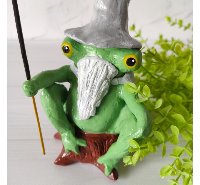 Wizard frog sitting on a hemp incense holder