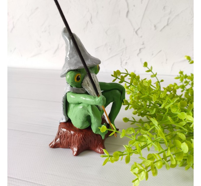 Wizard frog sitting on a hemp incense holder